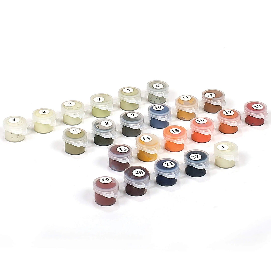 Numbered acrylic paint pots laid out from a Ledgebay extra paint set