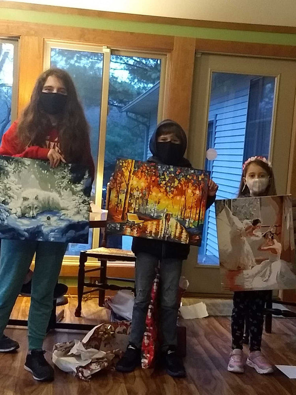 Paint by numbers completed by Pam C: three painters holding up the canvases they finished