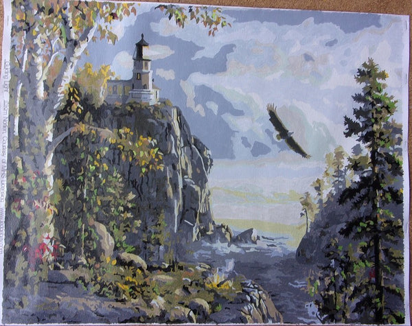 Guiding Light paint by numbers completed by Henry H: a clifftop lighthouse with an eagle over the water