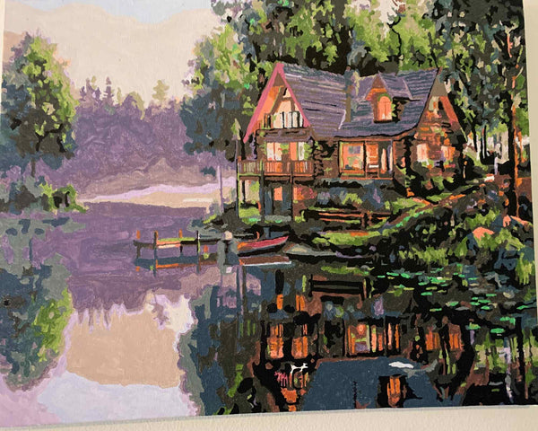 Cabin Fever paint by numbers completed by Al: a lit log cabin beside a lake at dusk