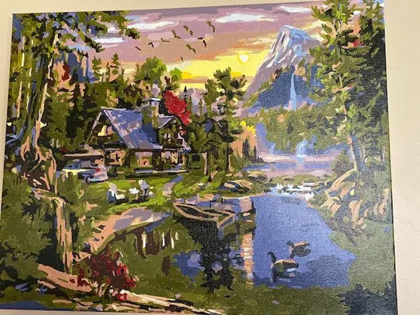 Mountain Paradise paint by numbers completed by Jennifer: a lakeside lodge below a waterfall
