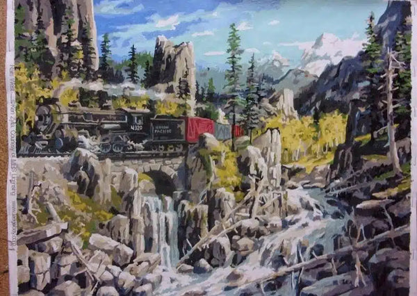 Paint by numbers completed by Henry H: a steam train crossing a stone bridge above a mountain gorge