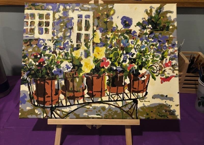 Rita's Pansies paint by numbers completed by Donna L: pansies in terracotta pots on a garden cart