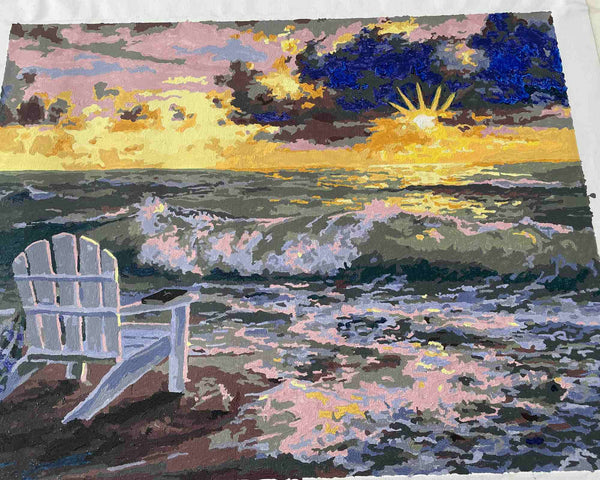 Be Still paint by numbers completed by Robert B: an empty white chair on the sand at sunset