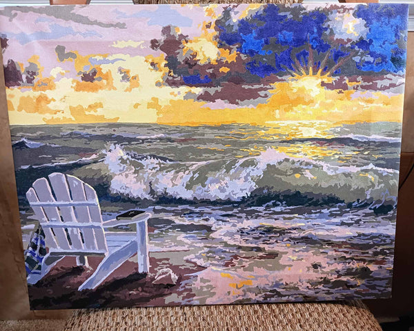 Be Still paint by numbers completed by Sandi K: an empty white chair on the sand at sunset