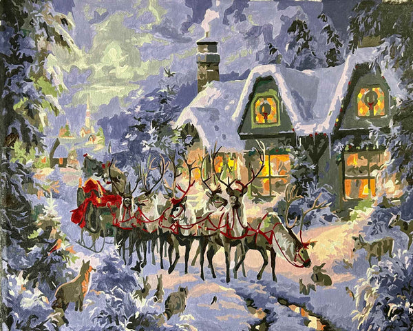 Christmas Magic paint by numbers completed by Tammie S: Santa's sleigh and reindeer outside a snowbound cottage
