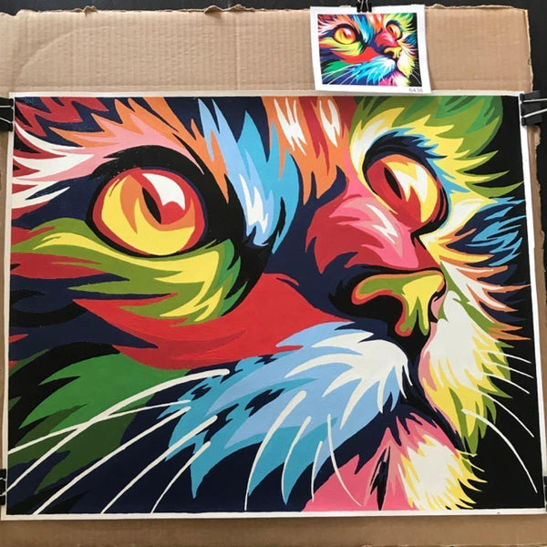 Paint by numbers completed by a customer: a cat's face in bold rainbow colors