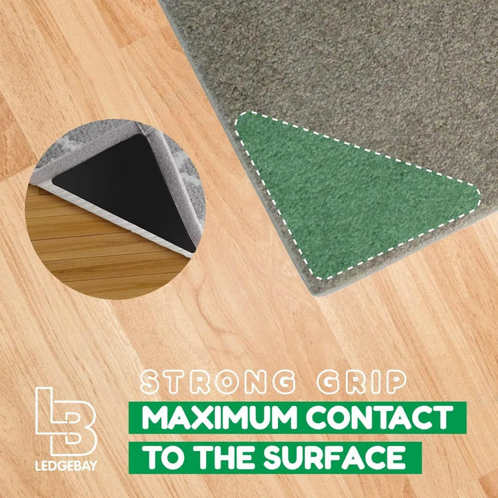 Close up of the double sided adhesive on a triangle rug gripper, rug side and floor side labelled